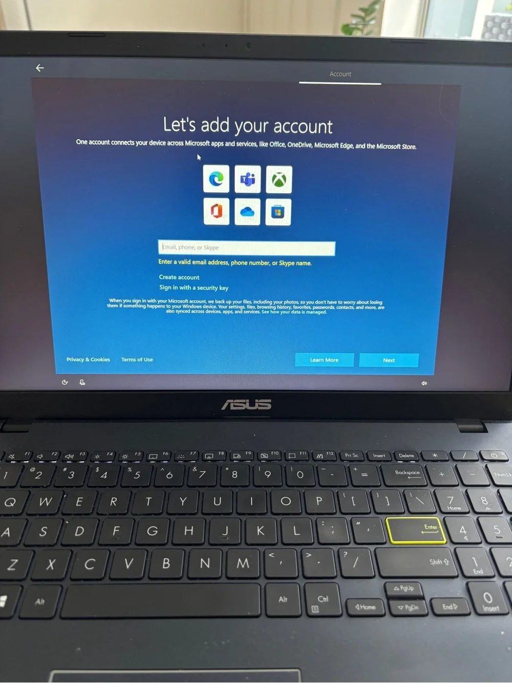 ASUS Matte Black Laptop with Highlighted Enter Key
